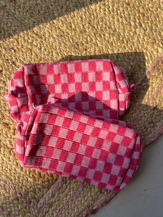 pink checkered pouch bag