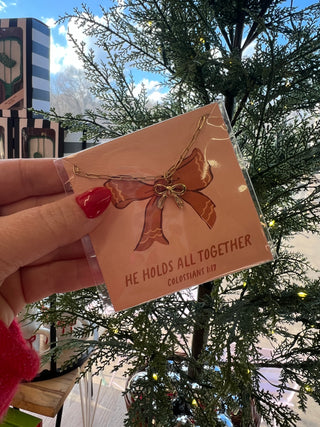 he holds all together bow necklace