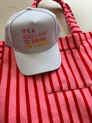 drink on a boat trucker hat